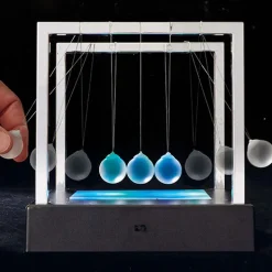 Pendule de Newton lumineux