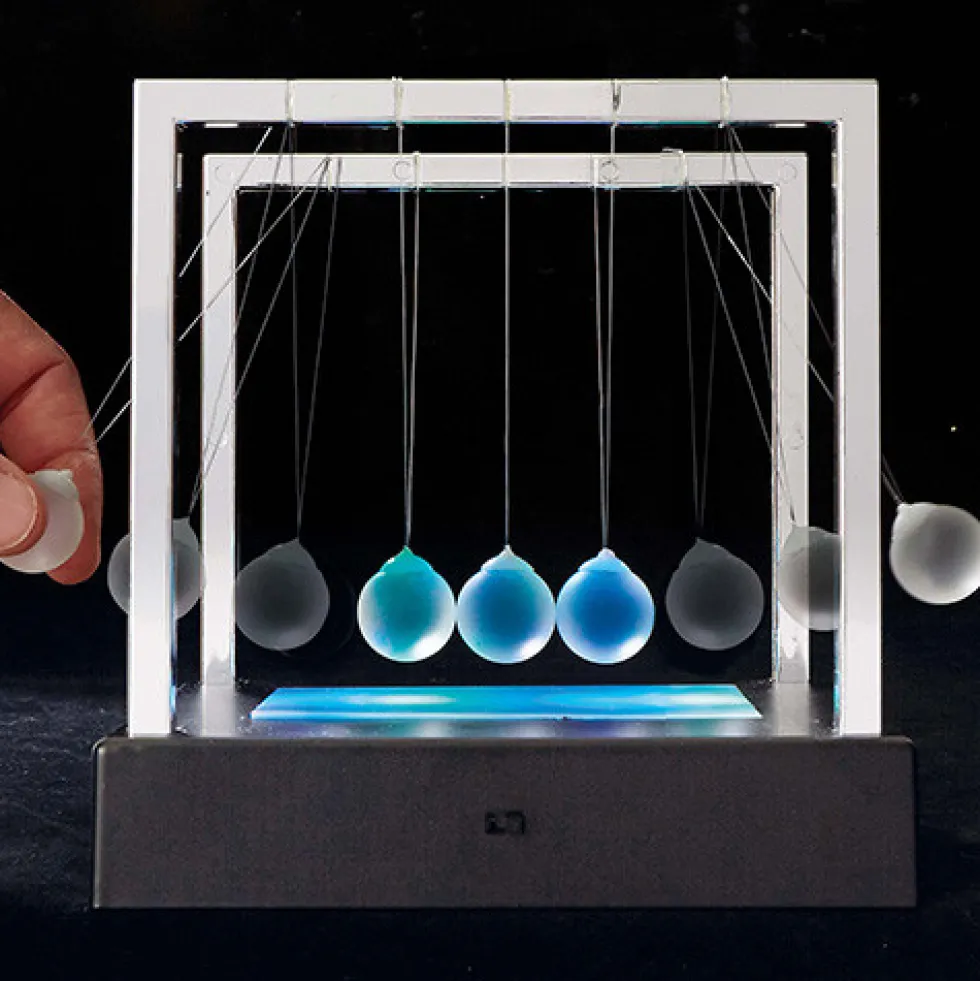 Pendule de Newton lumineux
